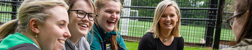 a group of female students laughing